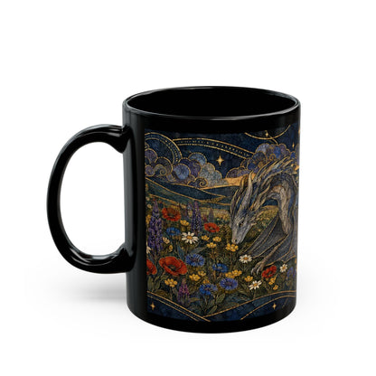A black ceramic coffee mug featuring an intricate illustration of a dragon in a wildflower field under a starry night sky.
