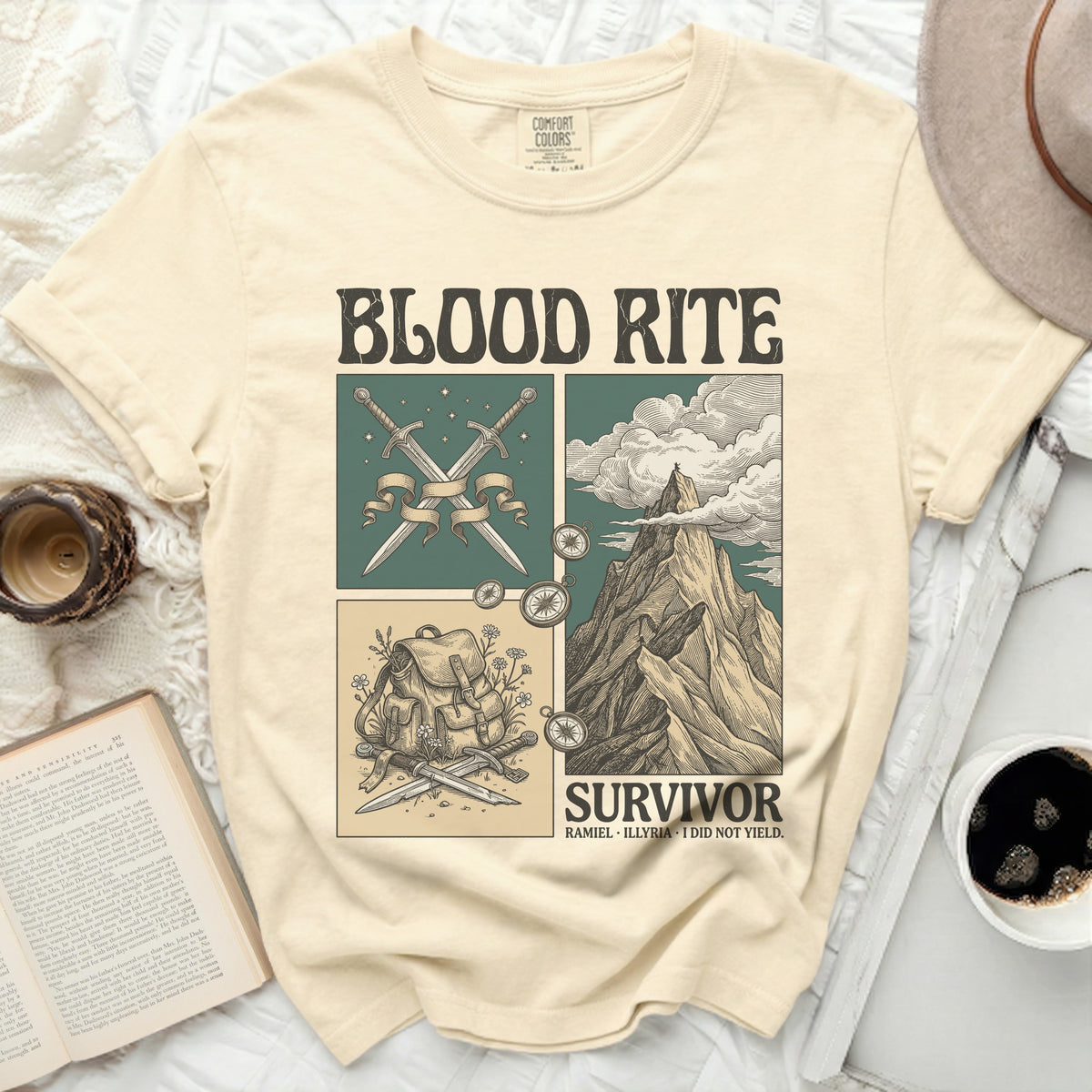 Cream t-shirt with "BLOOD RITE SURVIVOR" and sword, mountain, and backpack graphics.
