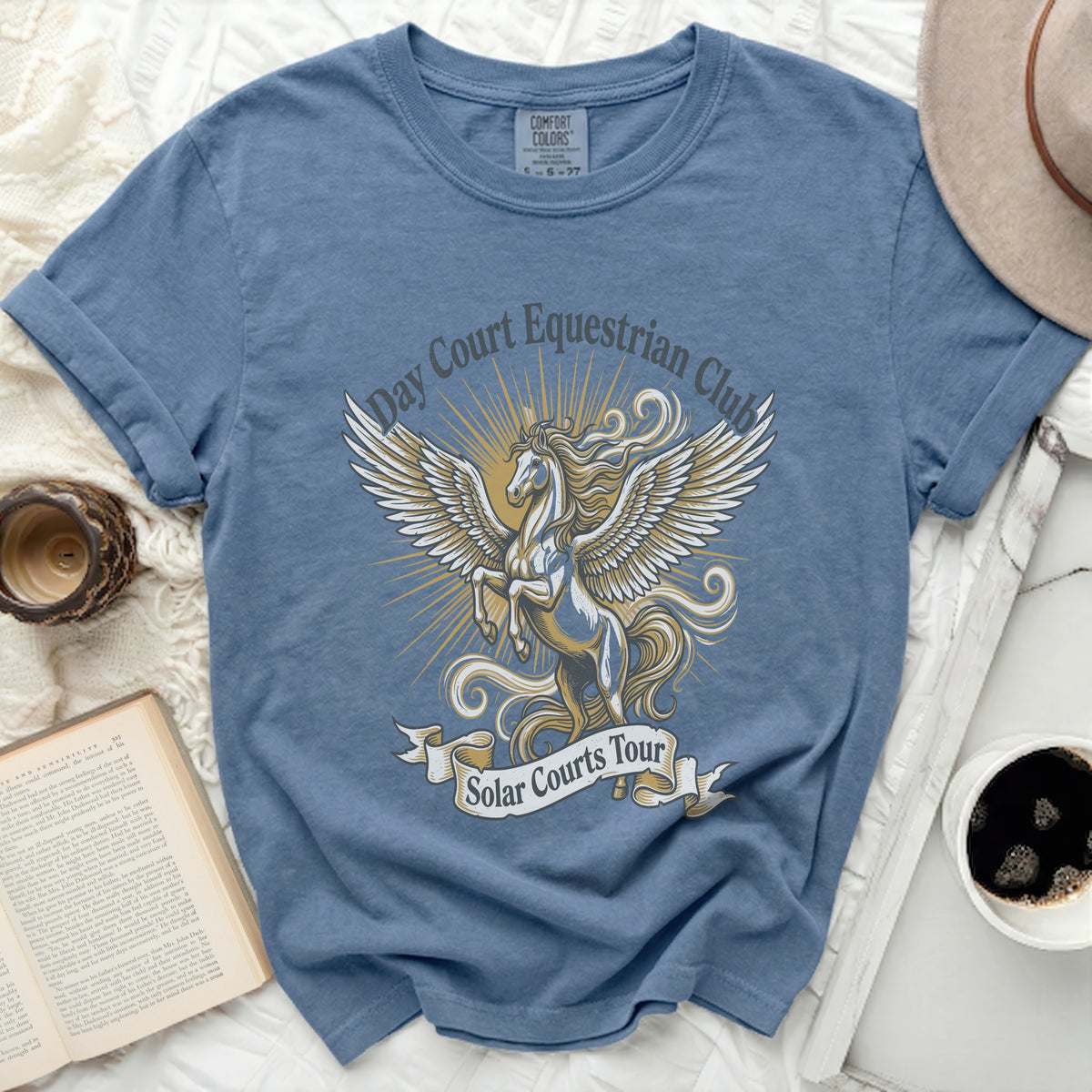 Blue t-shirt with winged horse graphic and text "Day Court Equestrian Club Solar Courts Tour".
