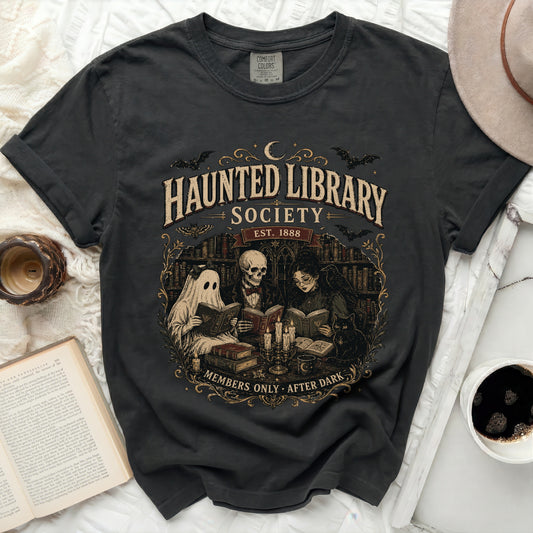 Haunted Library Society Est. 1888 graphic tee with ghost, skeleton, and witch.