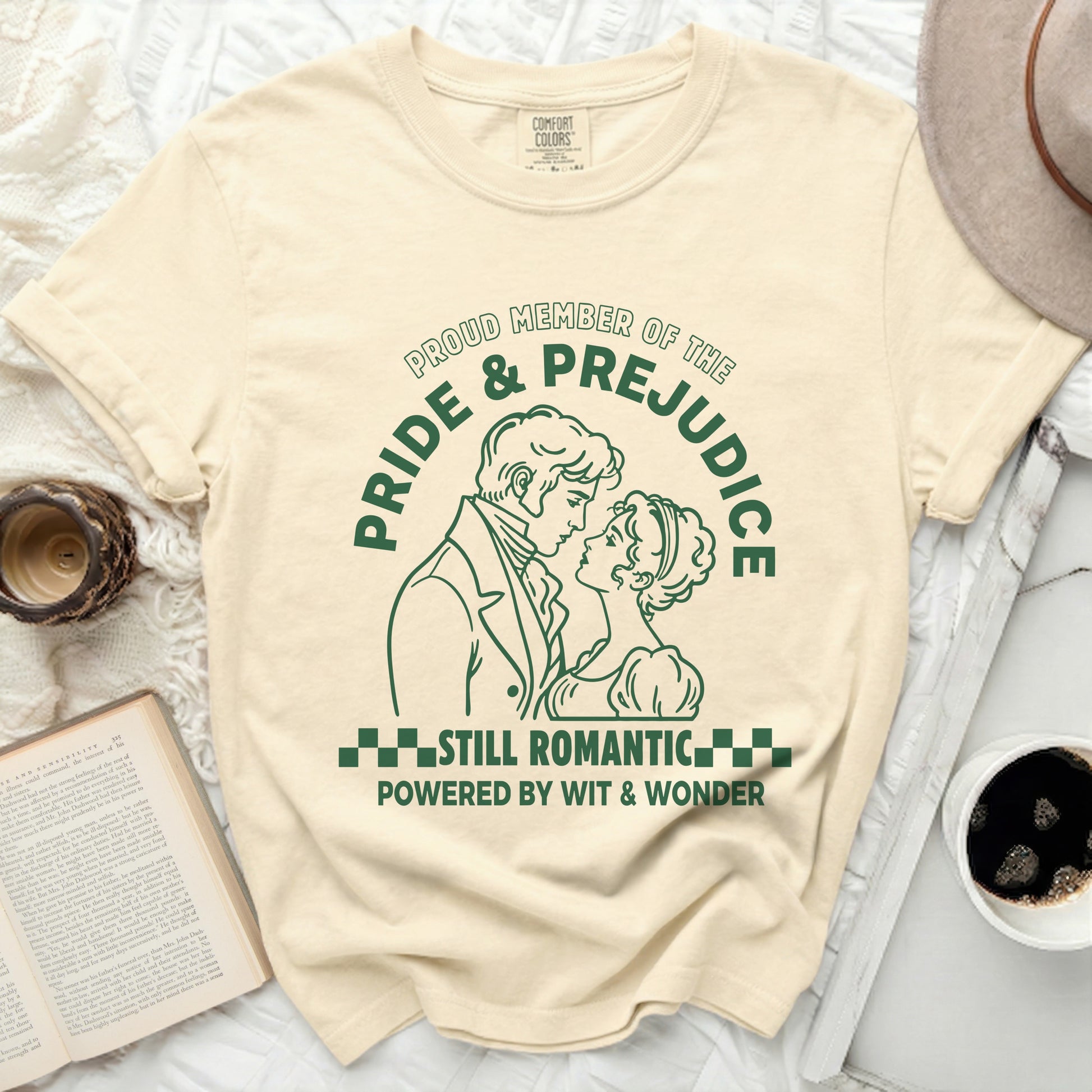 Pride & Prejudice graphic tee with couple, "Still Romantic Powered by Wit & Wonder."