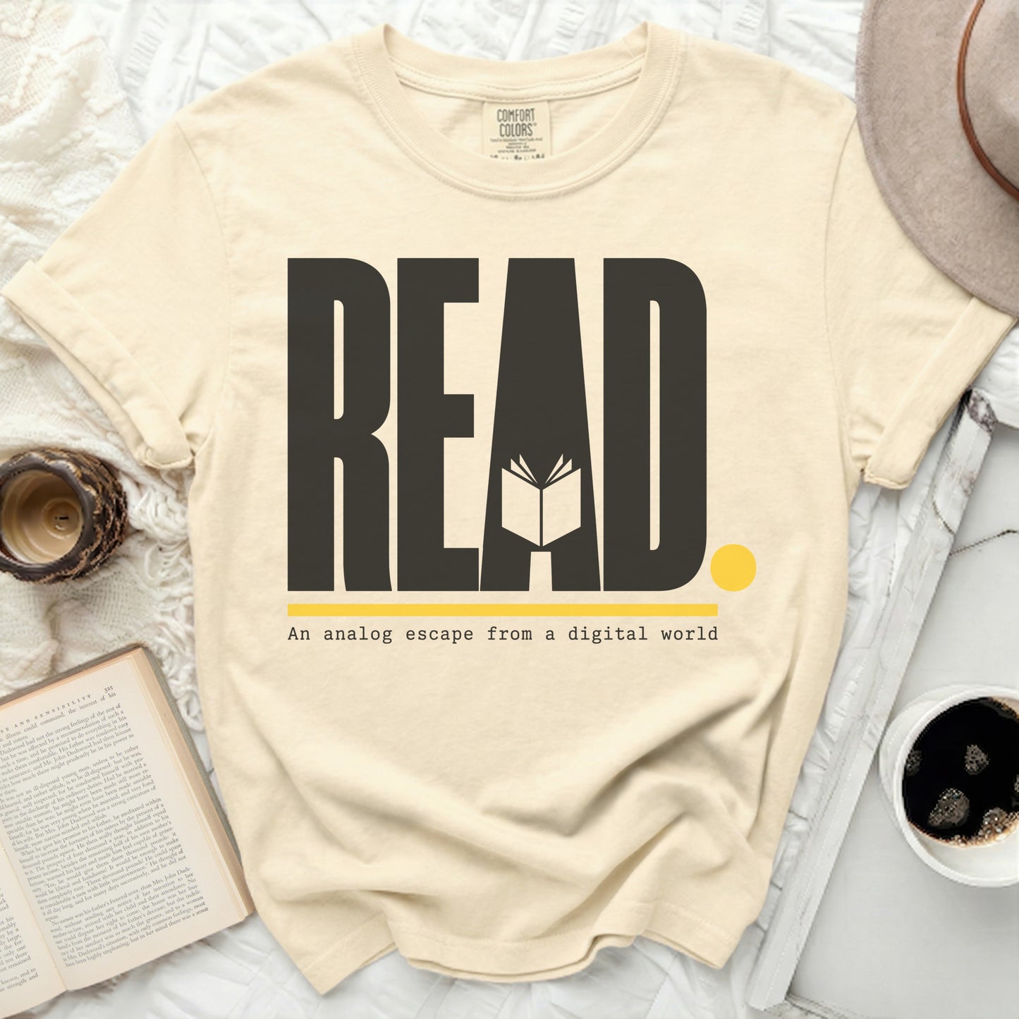 Cream t-shirt with "READ An analog escape from a digital world" graphic.