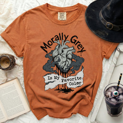 Orange t-shirt with a graphic of a heart and text "Morally Grey Is My Favorite Color".