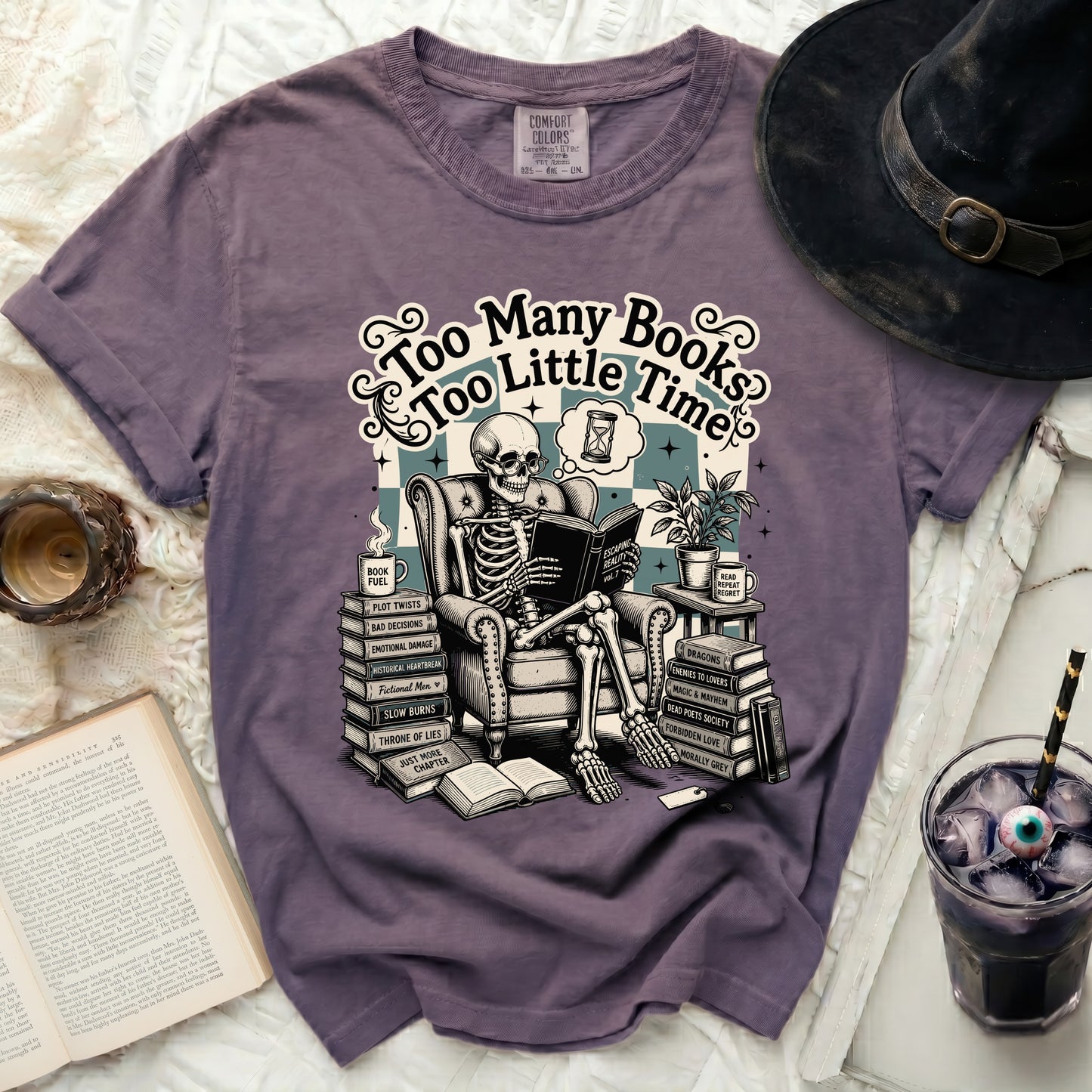 Skeleton reading in an armchair with "Too Many Books, Too Little Time" text.