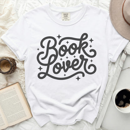 White t-shirt with "Book Lover" in a decorative script font.