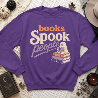 Purple sweatshirt with "Books Spook People" and a ghost reading on books.