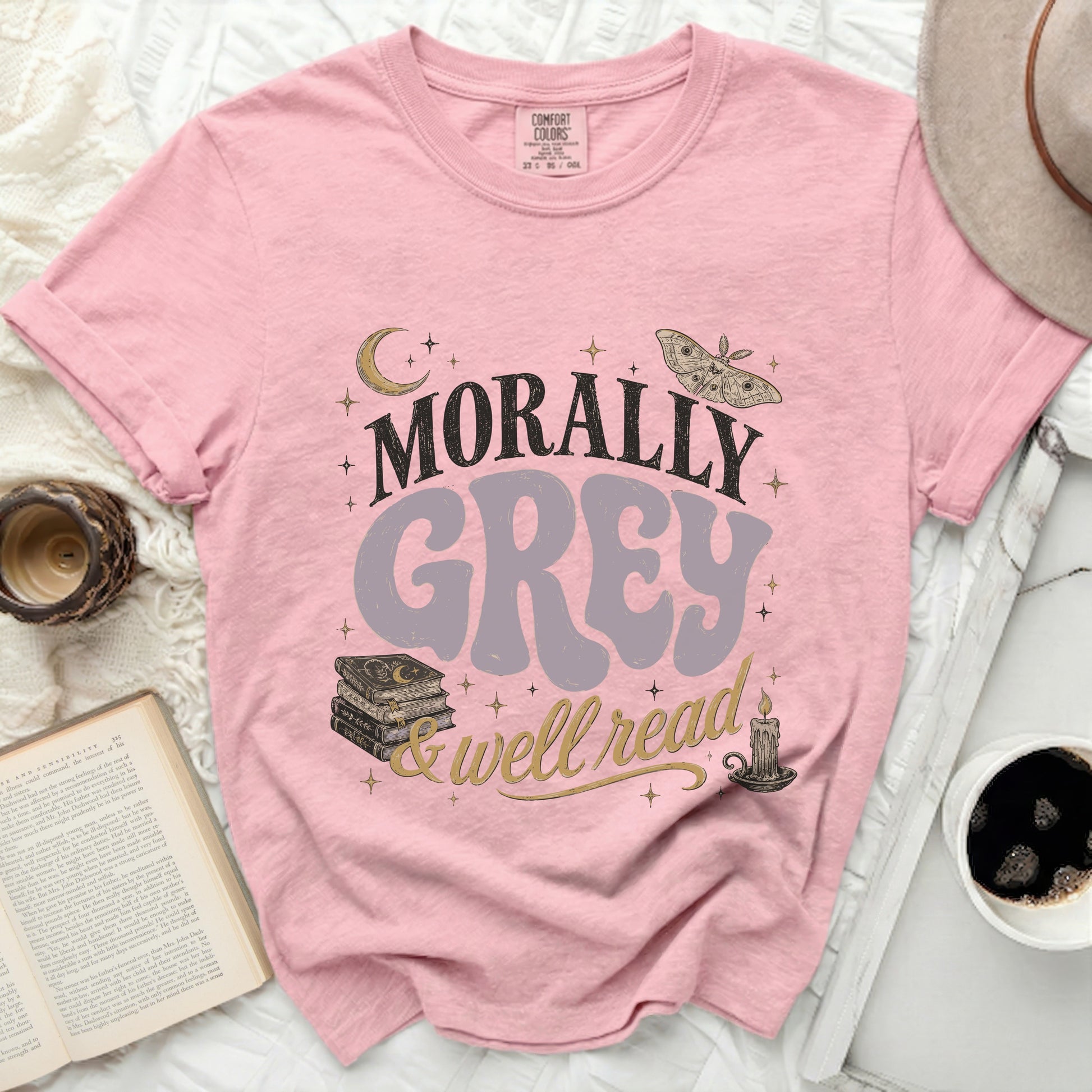 Pink Comfort Colors tee with "Morally Grey & Well Read" graphic.