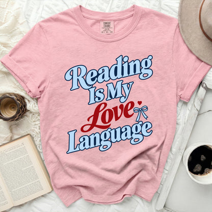 Pink t-shirt with "Reading Is My Love Language" text and a bow.