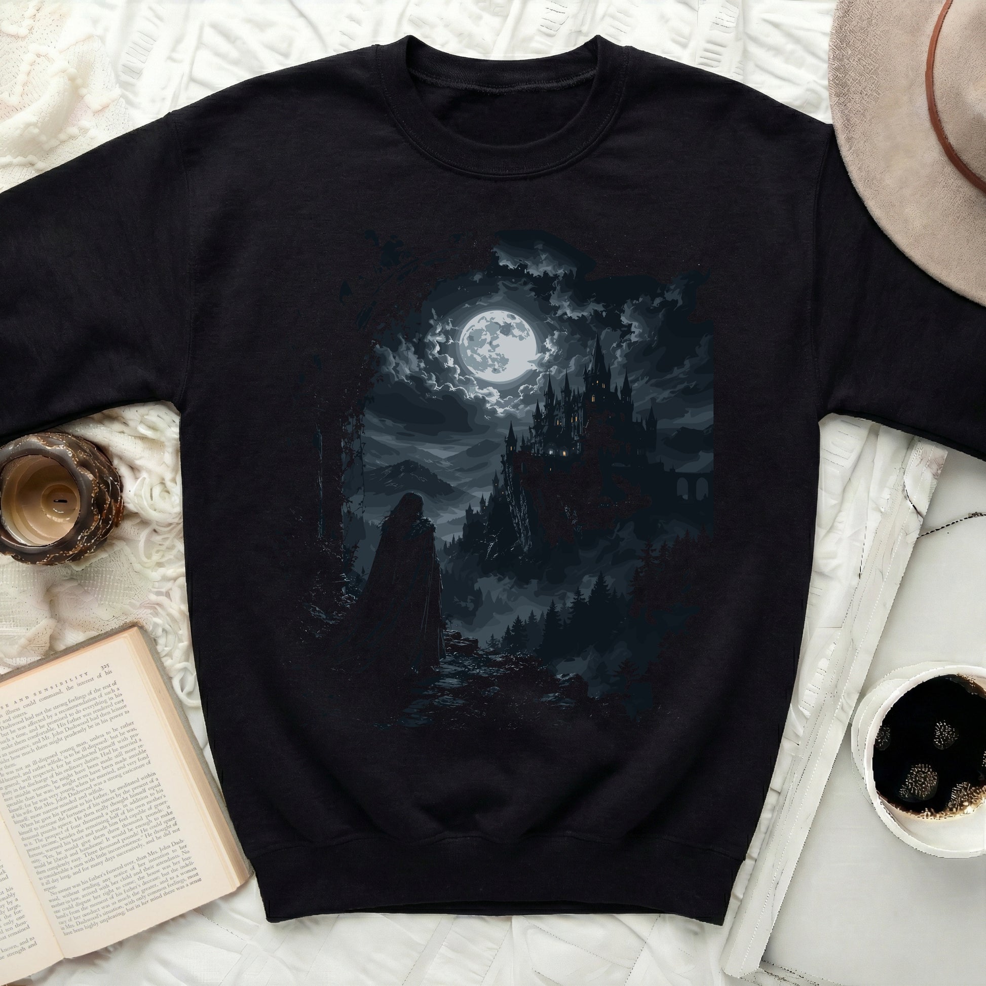 Black sweatshirt with gothic castle and full moon graphic.
