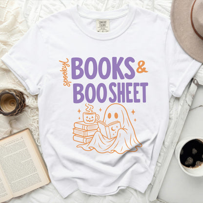 White t-shirt featuring "spooky BOOKS & BOO SHEET" graphic with a ghost reading.
