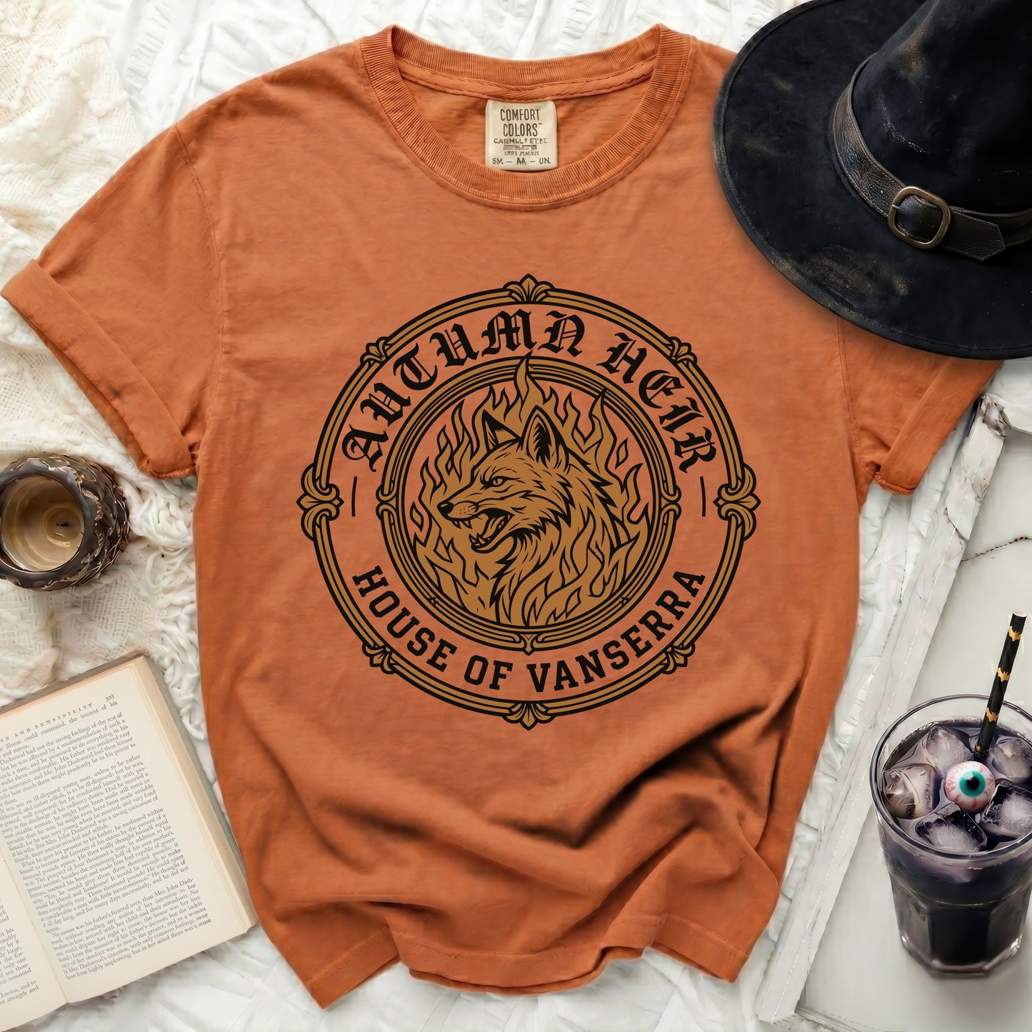 Orange t-shirt with "Autumn Heir House of Vanserra" wolf graphic.