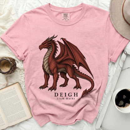 Pink t-shirt with a red dragon graphic and text "DEIGH LIAM MAIRI".