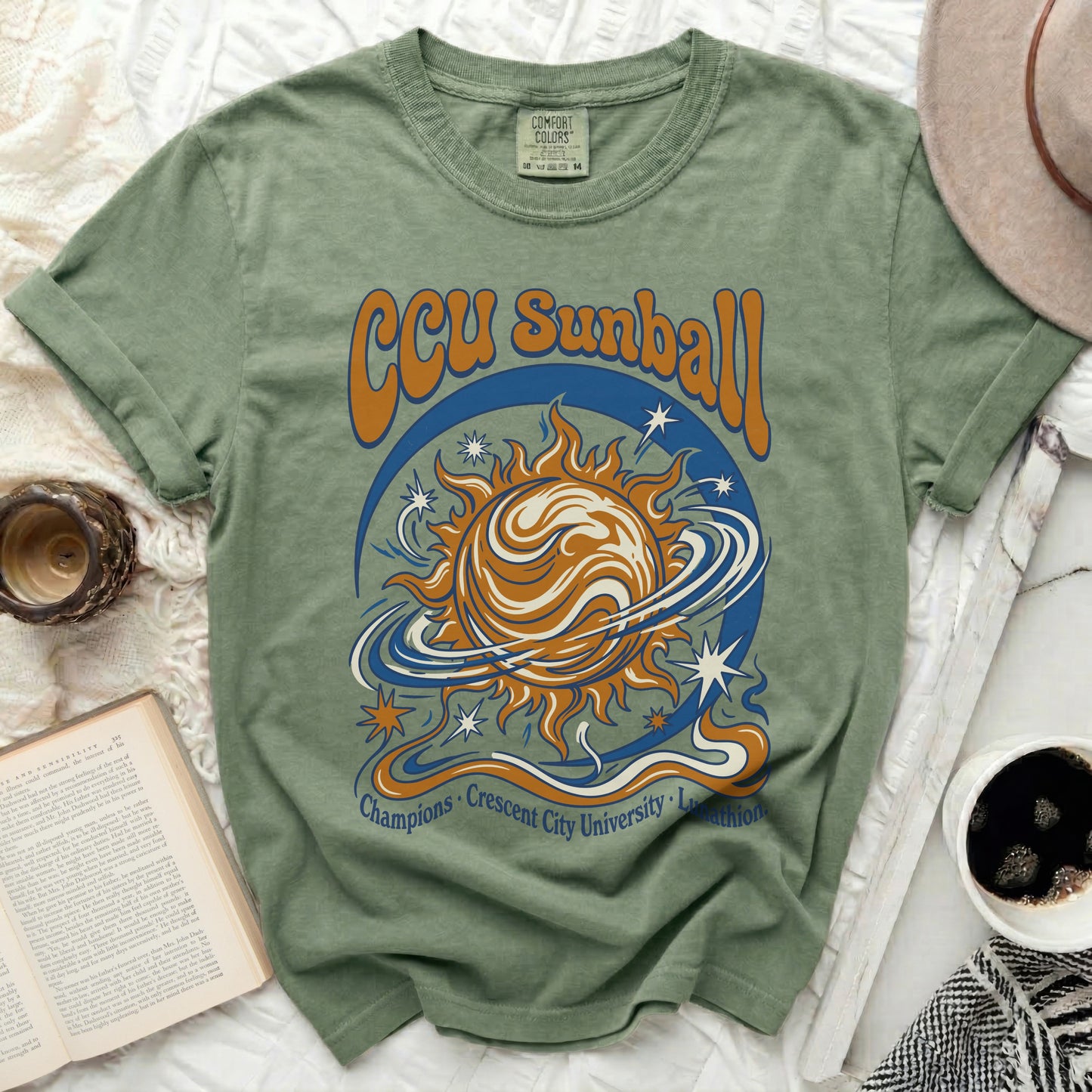 Green Comfort Colors t-shirt with CCU Sunball and text graphics.
