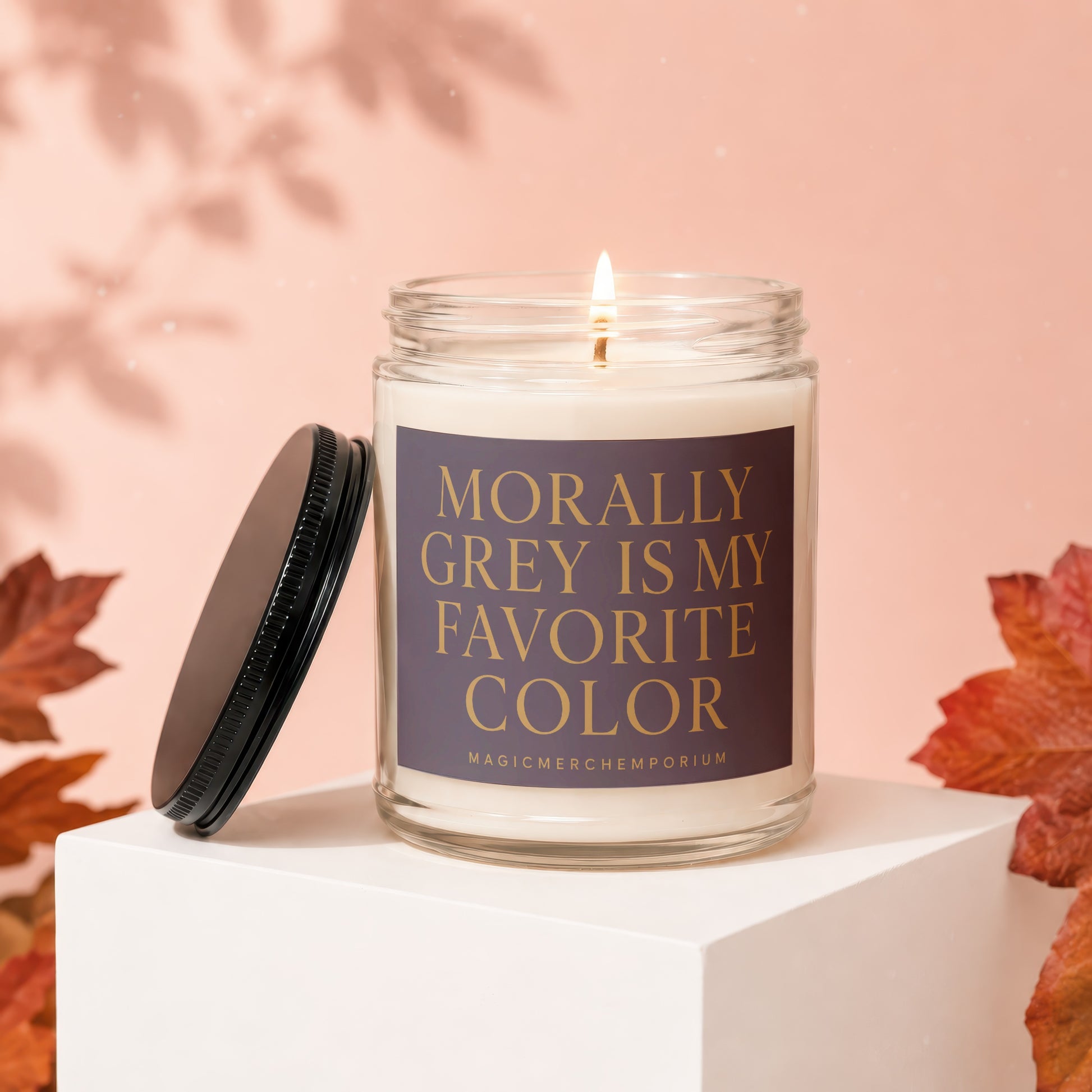 Glass candle with lid off, text "Morally Grey Is My Favorite Color".