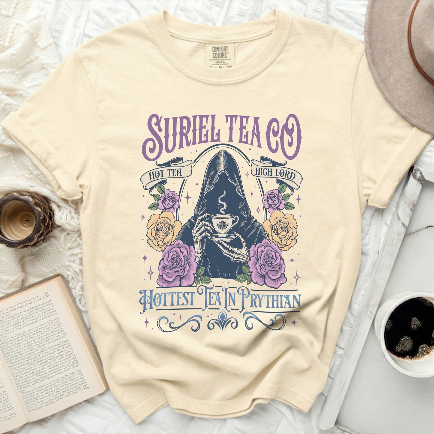 Cream comfort colors t-shirt with Suriel Tea Co. graphic of grim reaper and roses.
