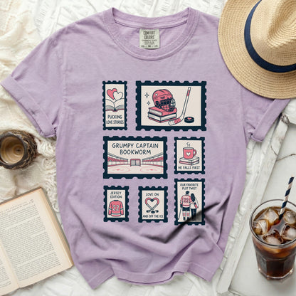 T-shirt with postage stamp graphics of hockey gear and couples.