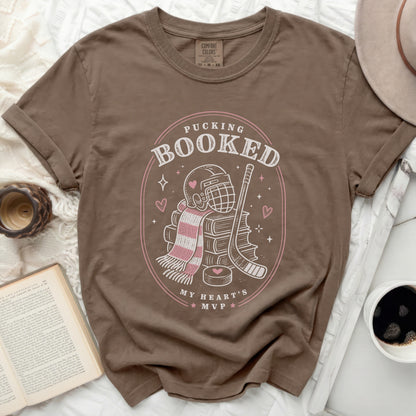 Brown t-shirt with "Pucking Booked My Heart's MVP" graphic.