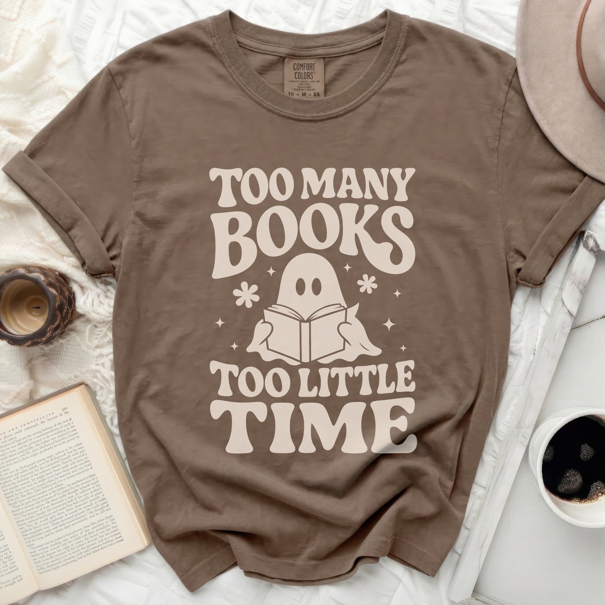 Brown t-shirt with "Too Many Books Too Little Time" ghost graphic.