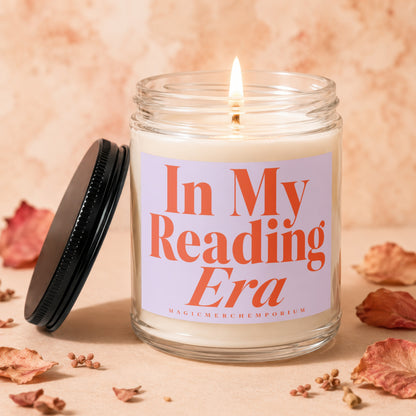 Lit candle in glass jar with lavender label reading "In My Reading Era".