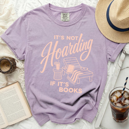 Purple t-shirt with "It's not hoarding if it's books" text.