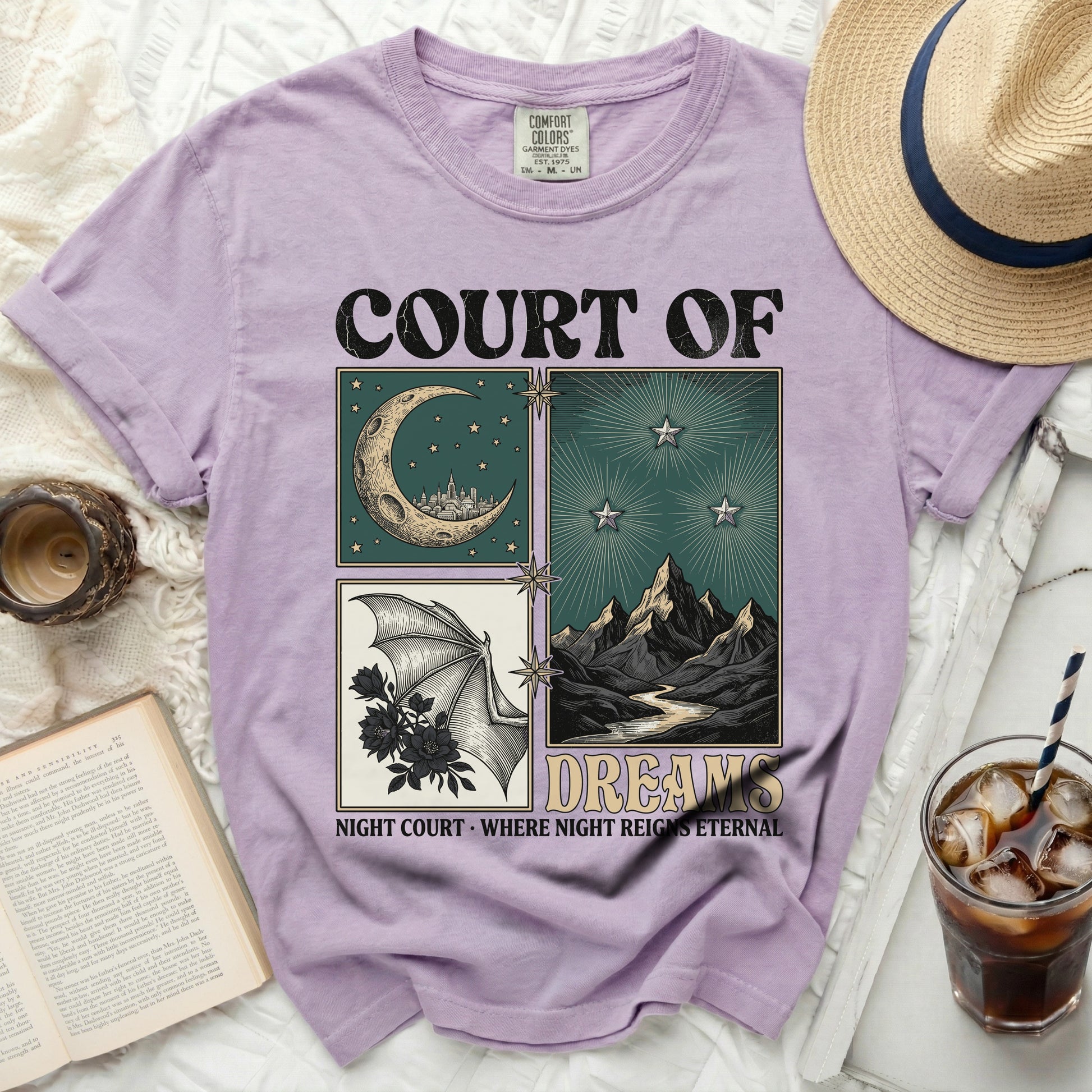 Purple t-shirt with "Court of Dreams" and moon, bat, and mountain graphics.