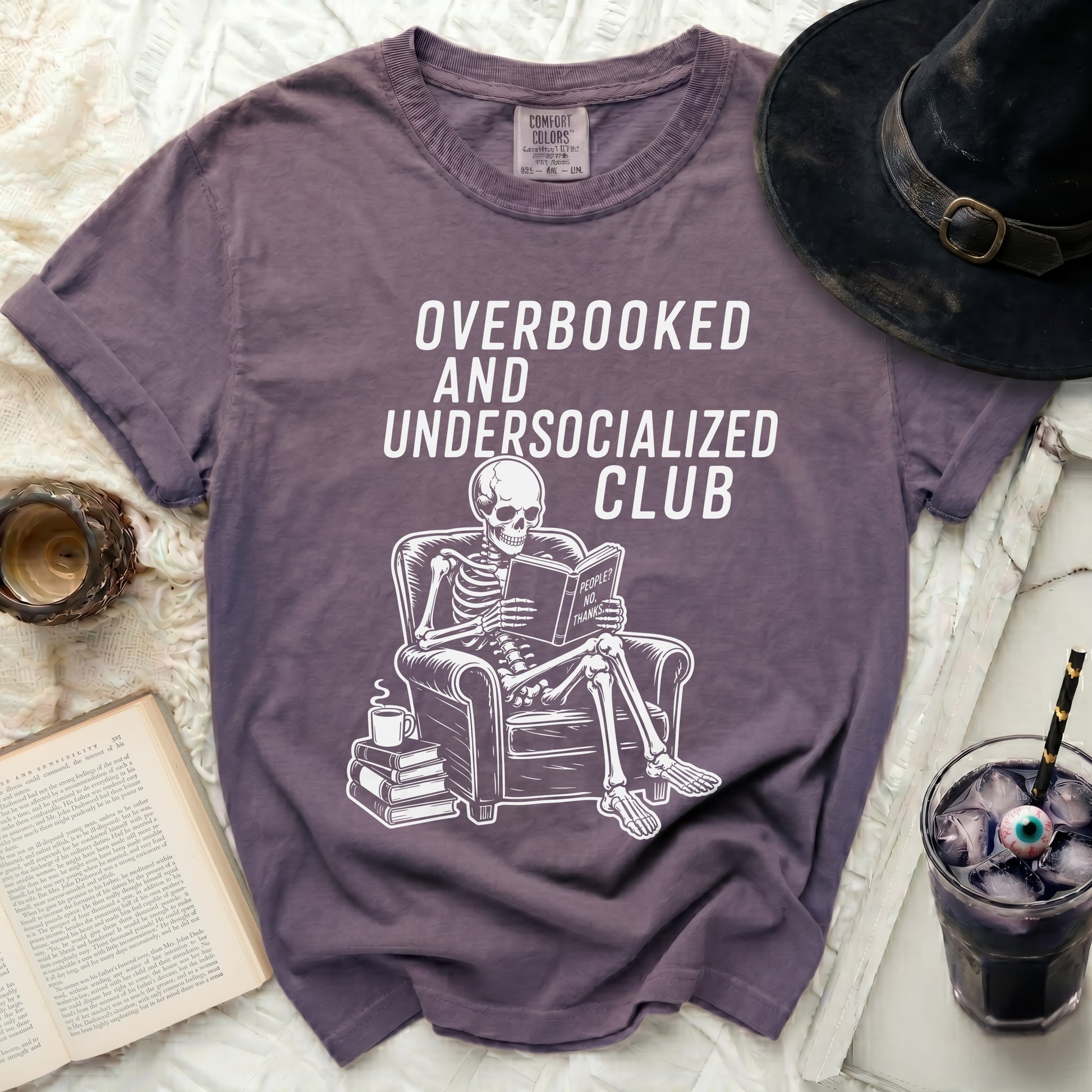 Purple t-shirt with skeleton reading "People? No, Thanks." Club.