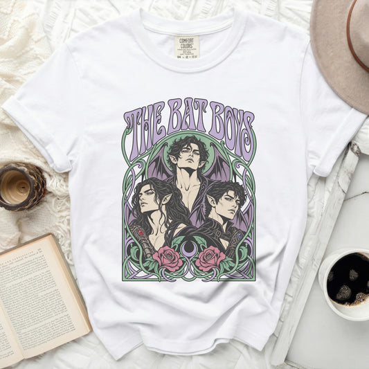 White t-shirt with "THE BAT BOYS" text and illustration of three winged figures.