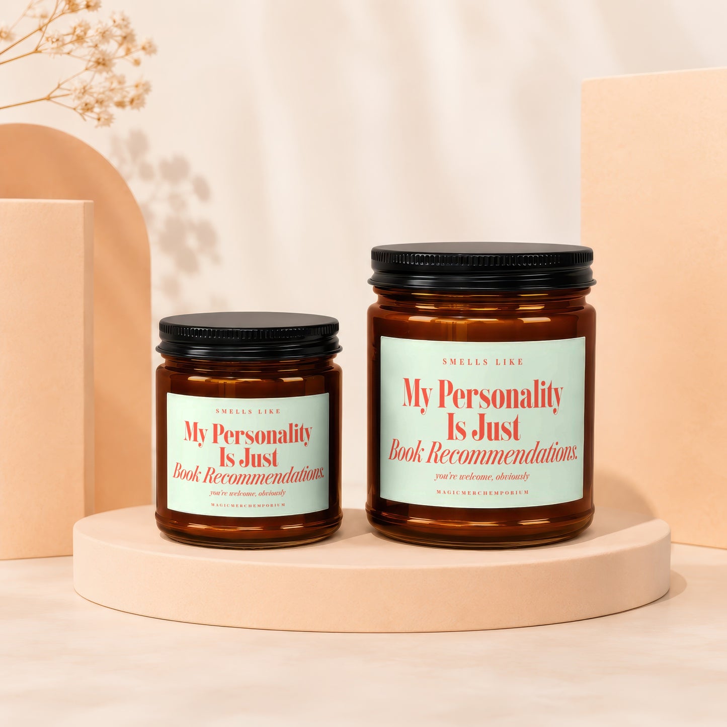 Two amber jars with black lids displaying "My Personality Is Just Book Recommendations".