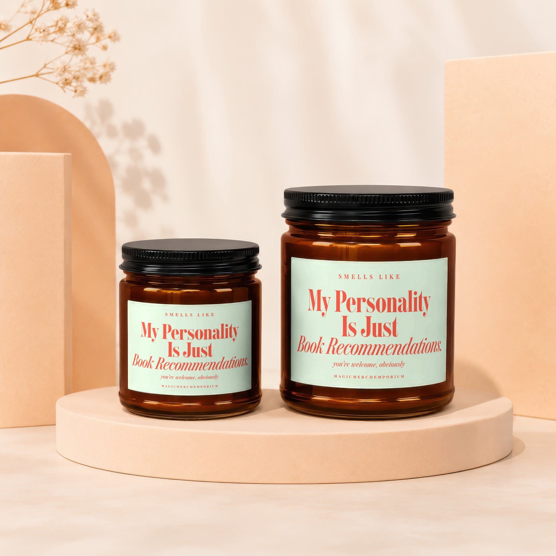 Two amber jars with black lids displaying "My Personality Is Just Book Recommendations".