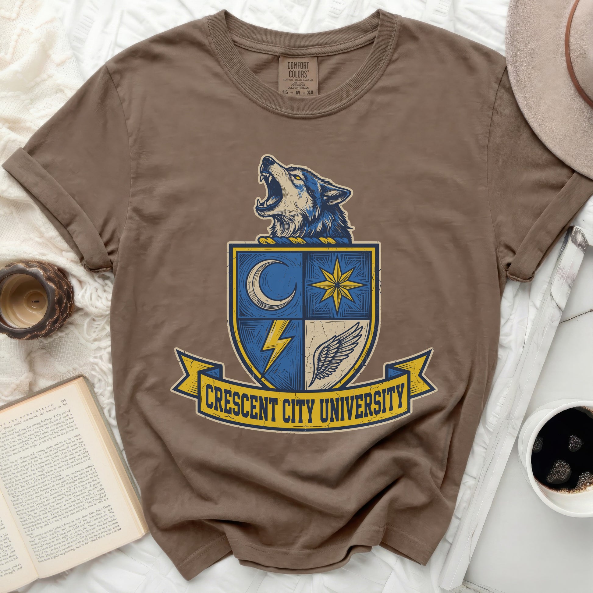 Brown t-shirt with Crescent City University shield logo and roaring wolf.
