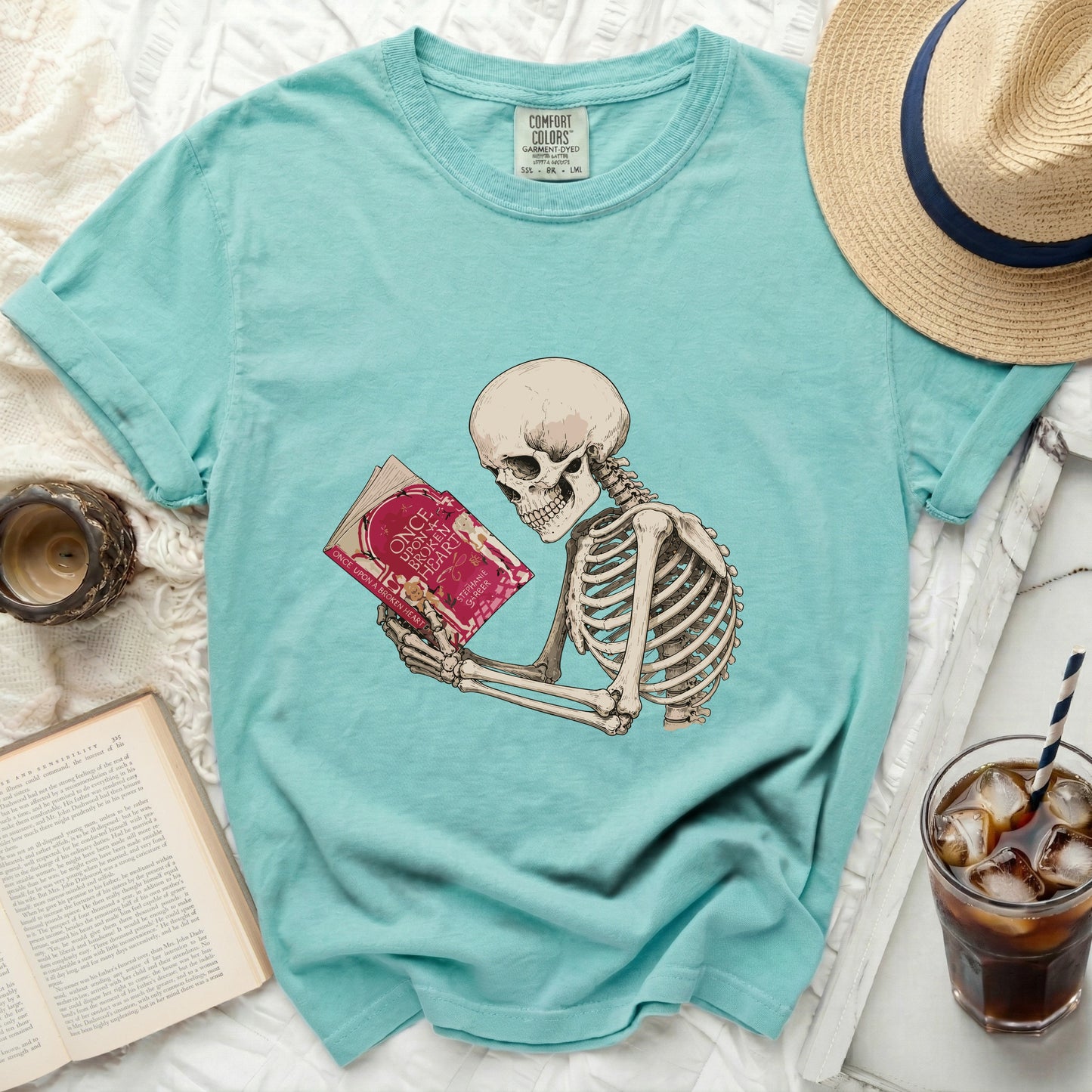 Skeleton reading a book titled Once Upon a Broken Heart T-shirt.