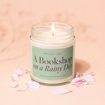 Lit candle with "Smells Like A Bookshop on a Rainy Day" label.