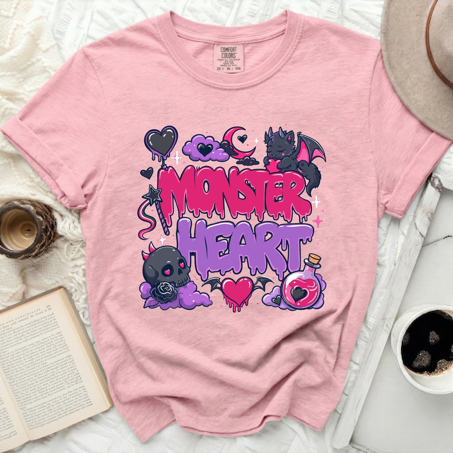 Pink t-shirt with "Monster Heart" text and spooky illustrations.
