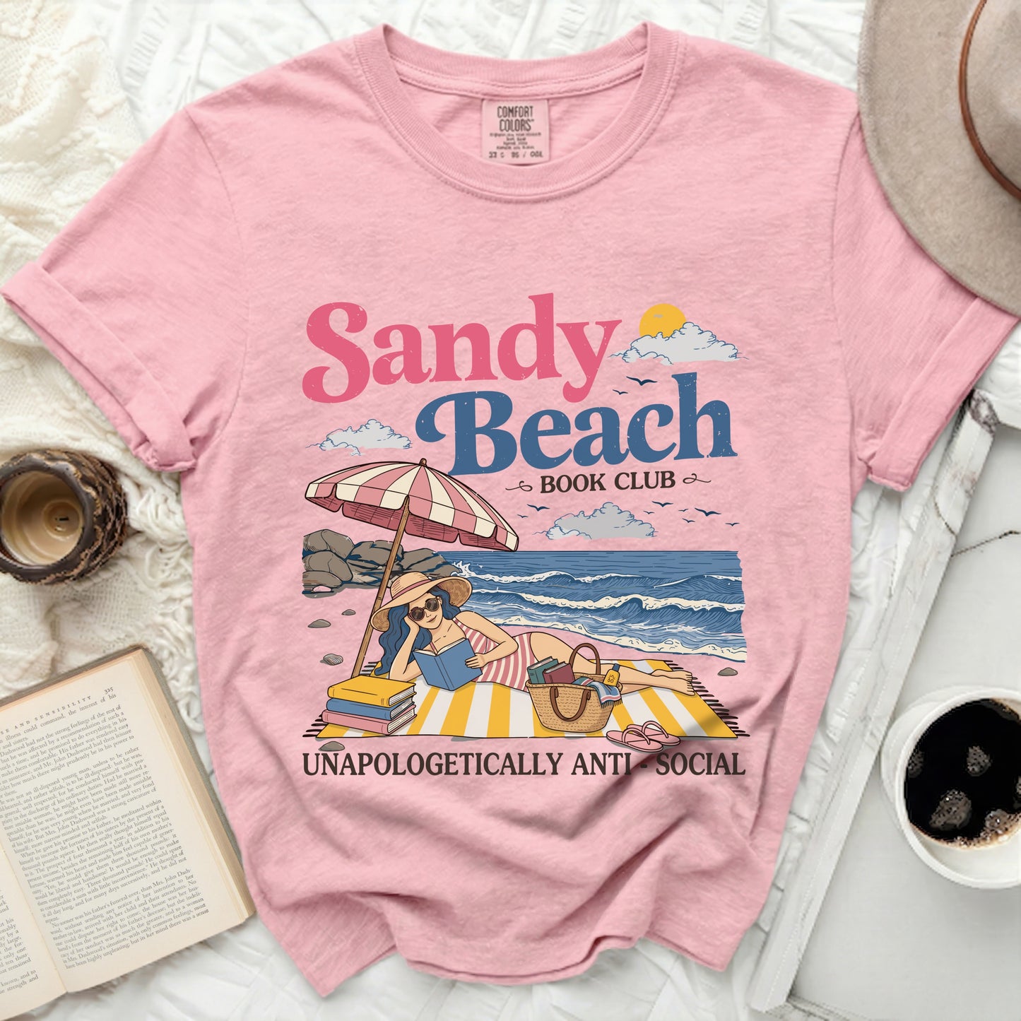 Pink t-shirt with Sandy Beach Book Club graphic and anti-social text