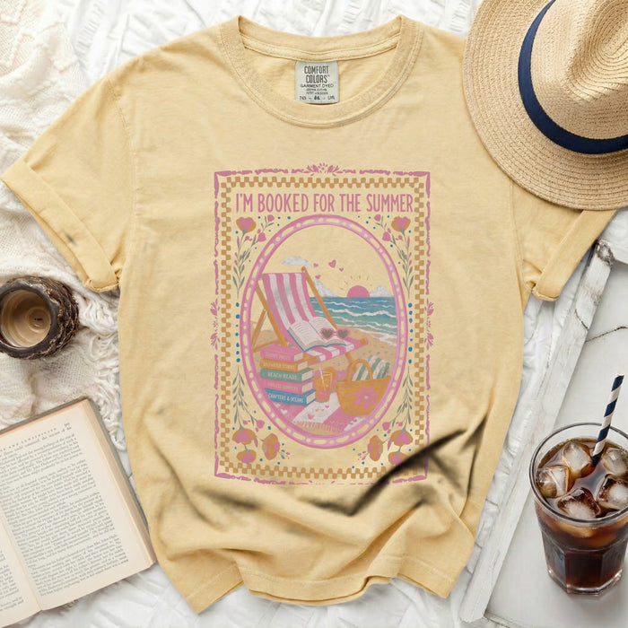 Yellow t-shirt with "I'm Booked for the Summer" text and beach scene illustration.