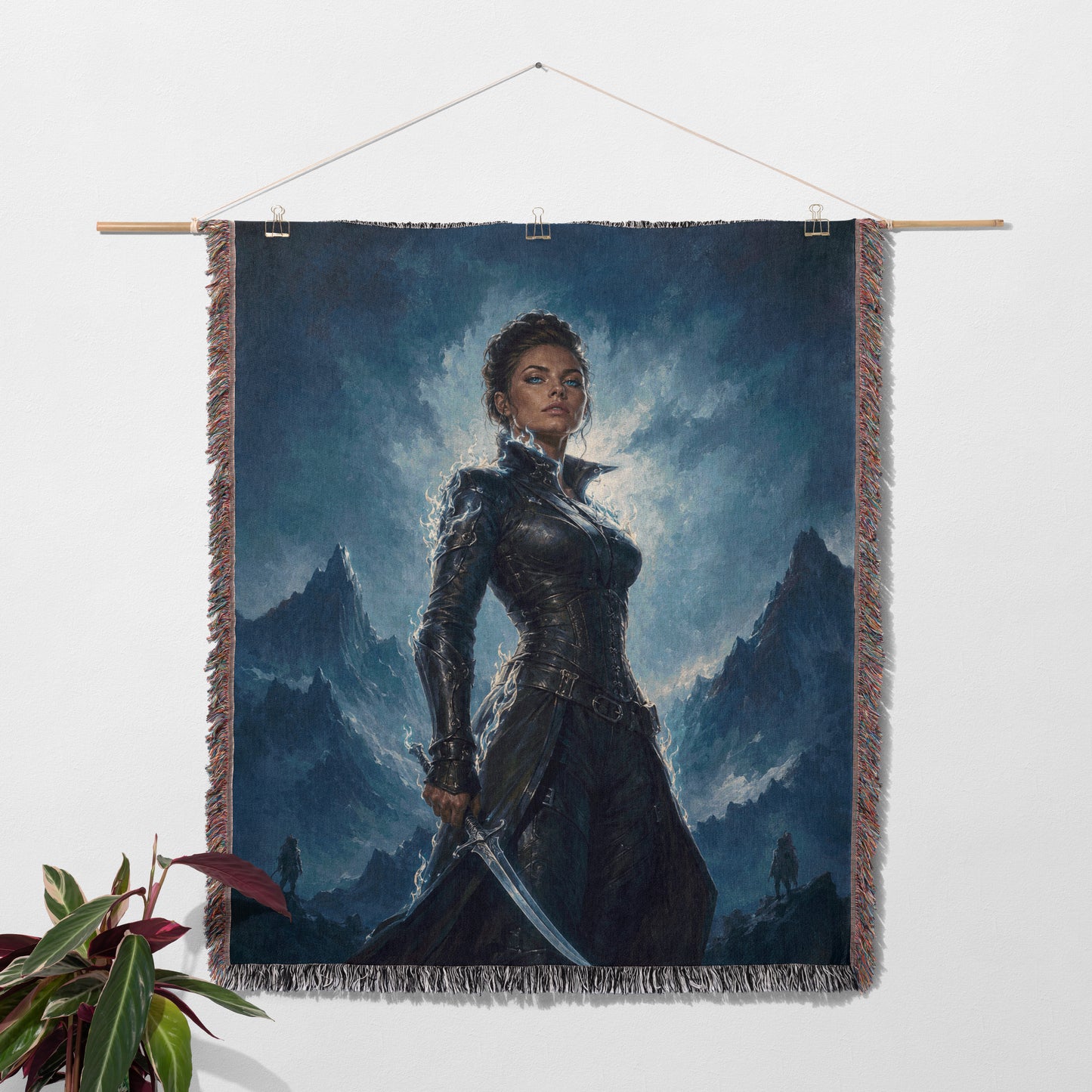 a woman standing in a dark, mountainous landscape, holding a sword.