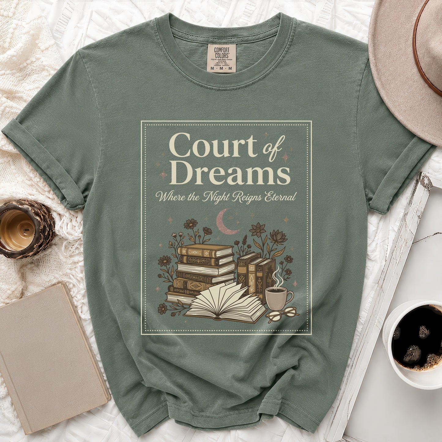 Green t-shirt with "Court of Dreams Where the Night Reigns Eternal" text and book illustration.