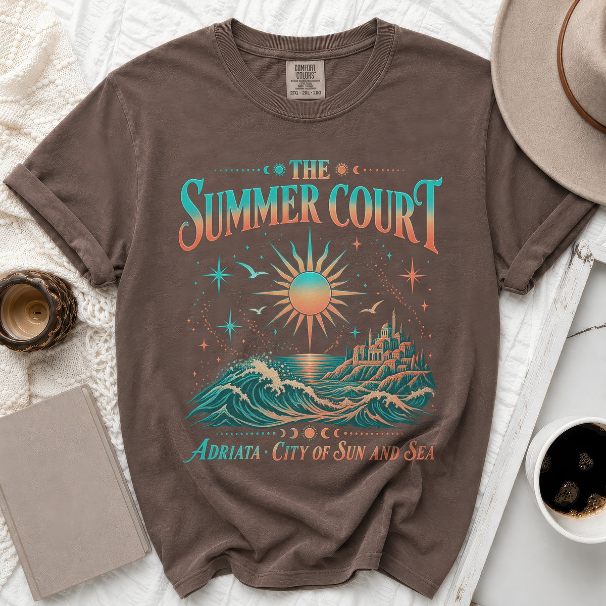 Brown t-shirt with "The Summer Court Adriata City of Sun and Sea" graphic.