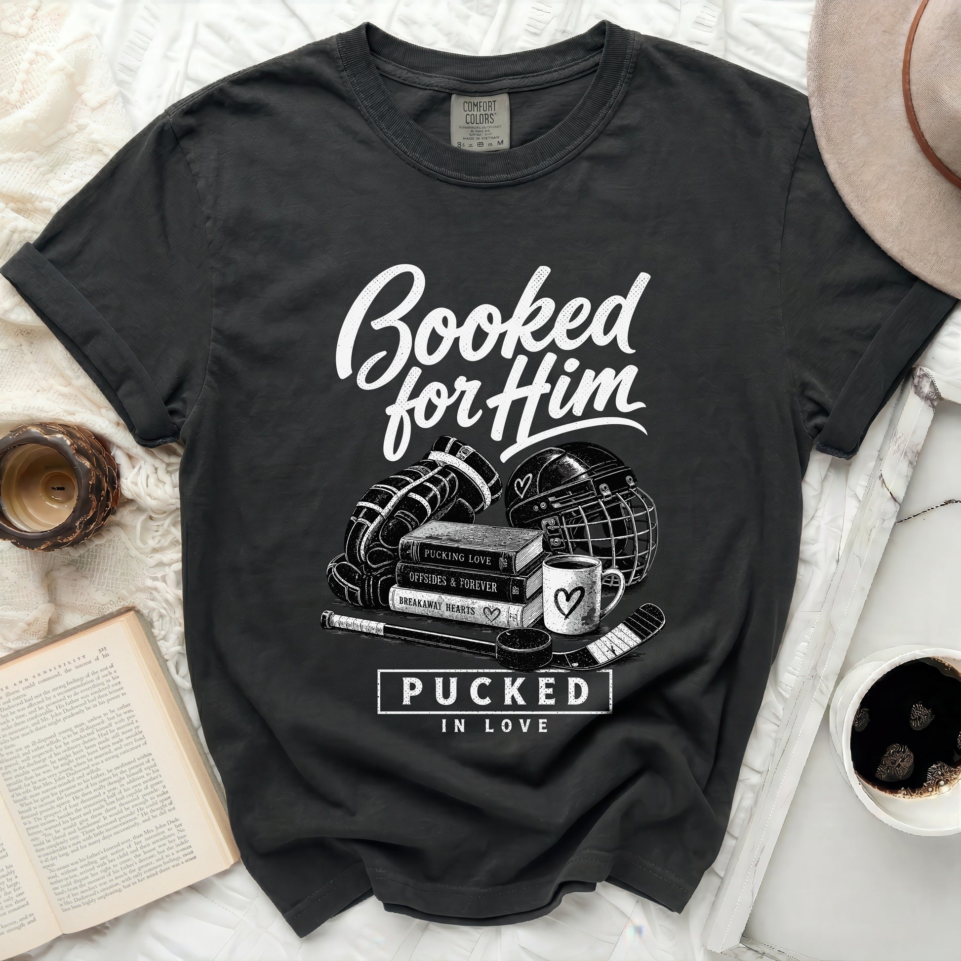 Black t-shirt with "Booked for Him" and hockey graphics.