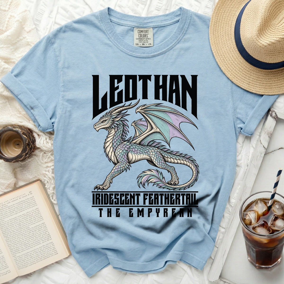 Light blue t-shirt with a dragon graphic and "LEODTHAN IRIDESCENT FEATHERTAIL THE EMPYREAN" text.