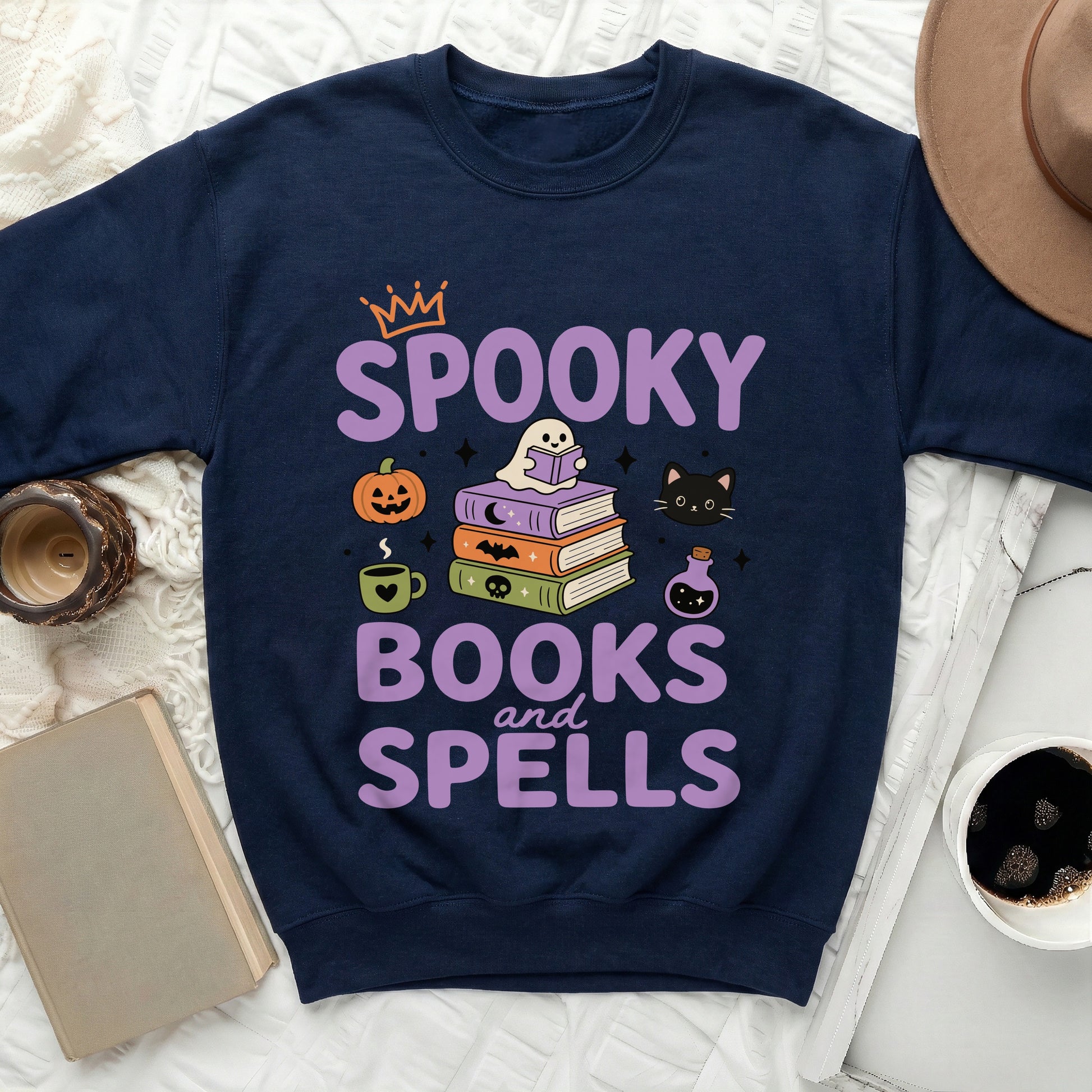 Navy sweatshirt with "Spooky Books and Spells" Halloween graphic.