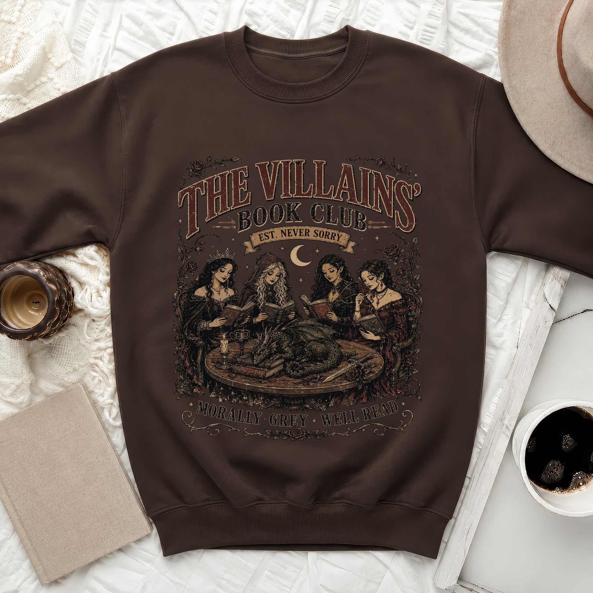 Brown sweatshirt with "The Villains Book Club" graphic featuring women reading and a dragon.