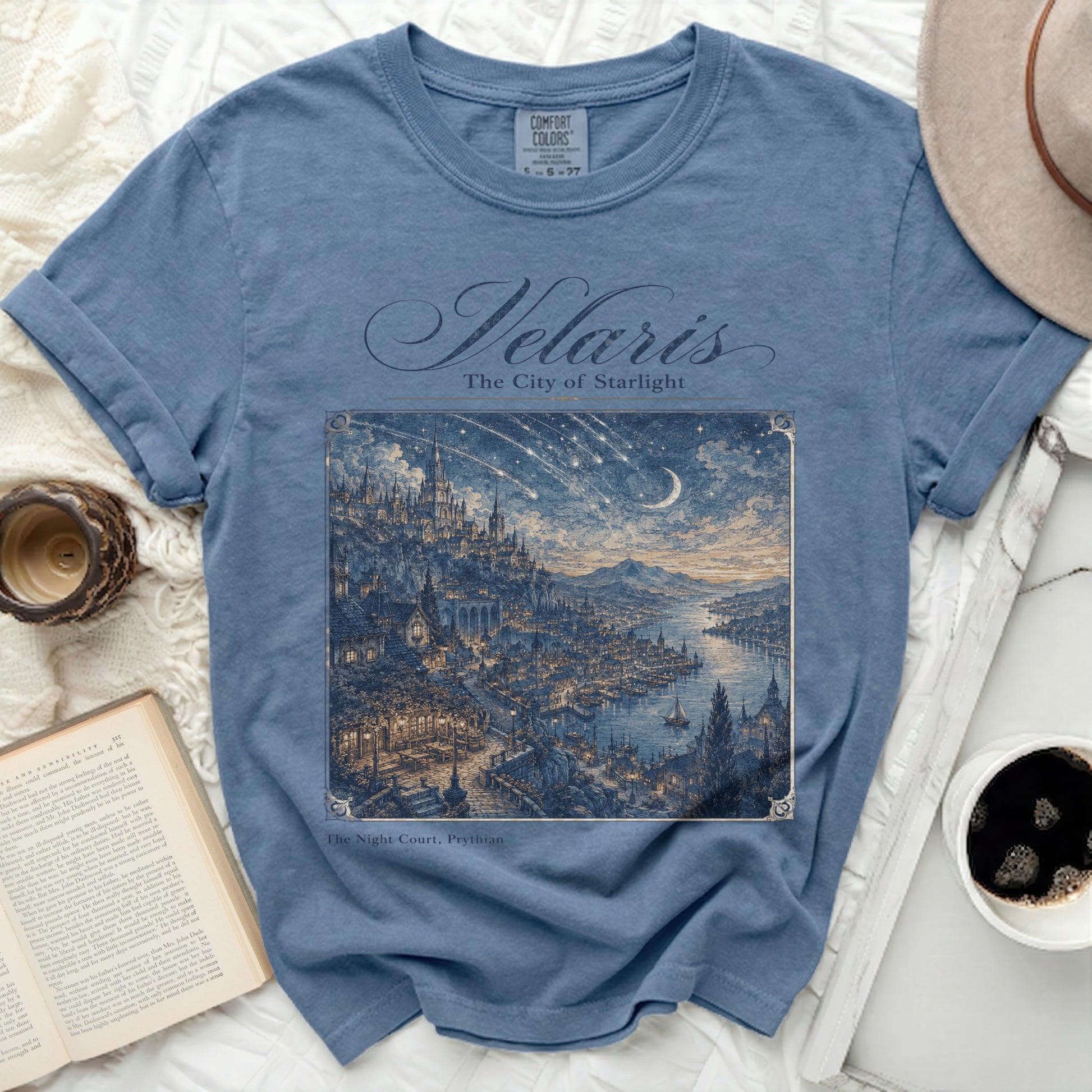 Blue t-shirt with "Velaris The City of Starlight" and fantasy city print.