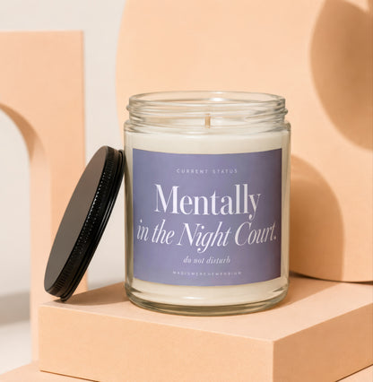 Glass candle with black lid and lavender label reading "Mentally in the Night Court. do not disturb."