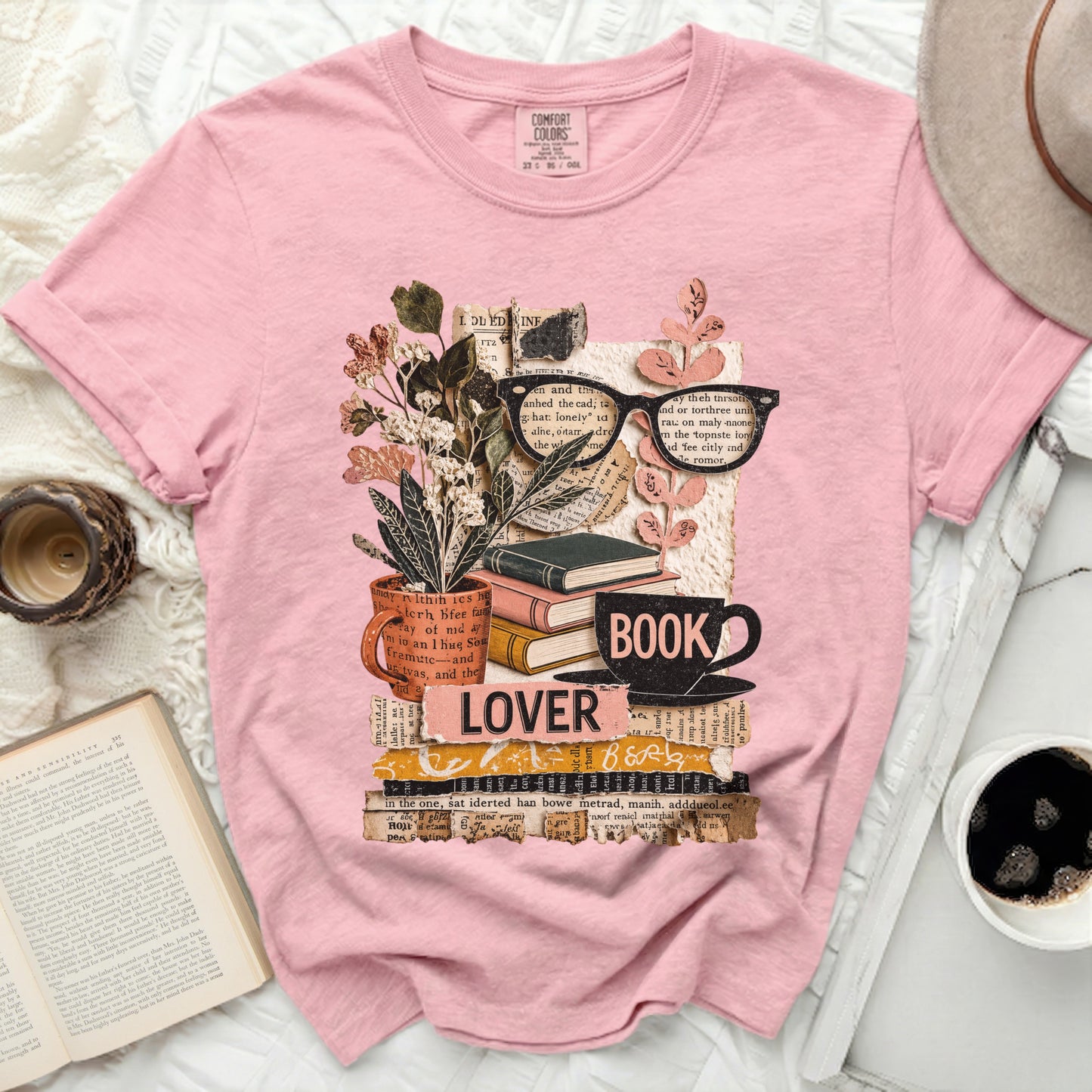 Pink t-shirt with "lover book" graphic featuring stacked books and floral elements.