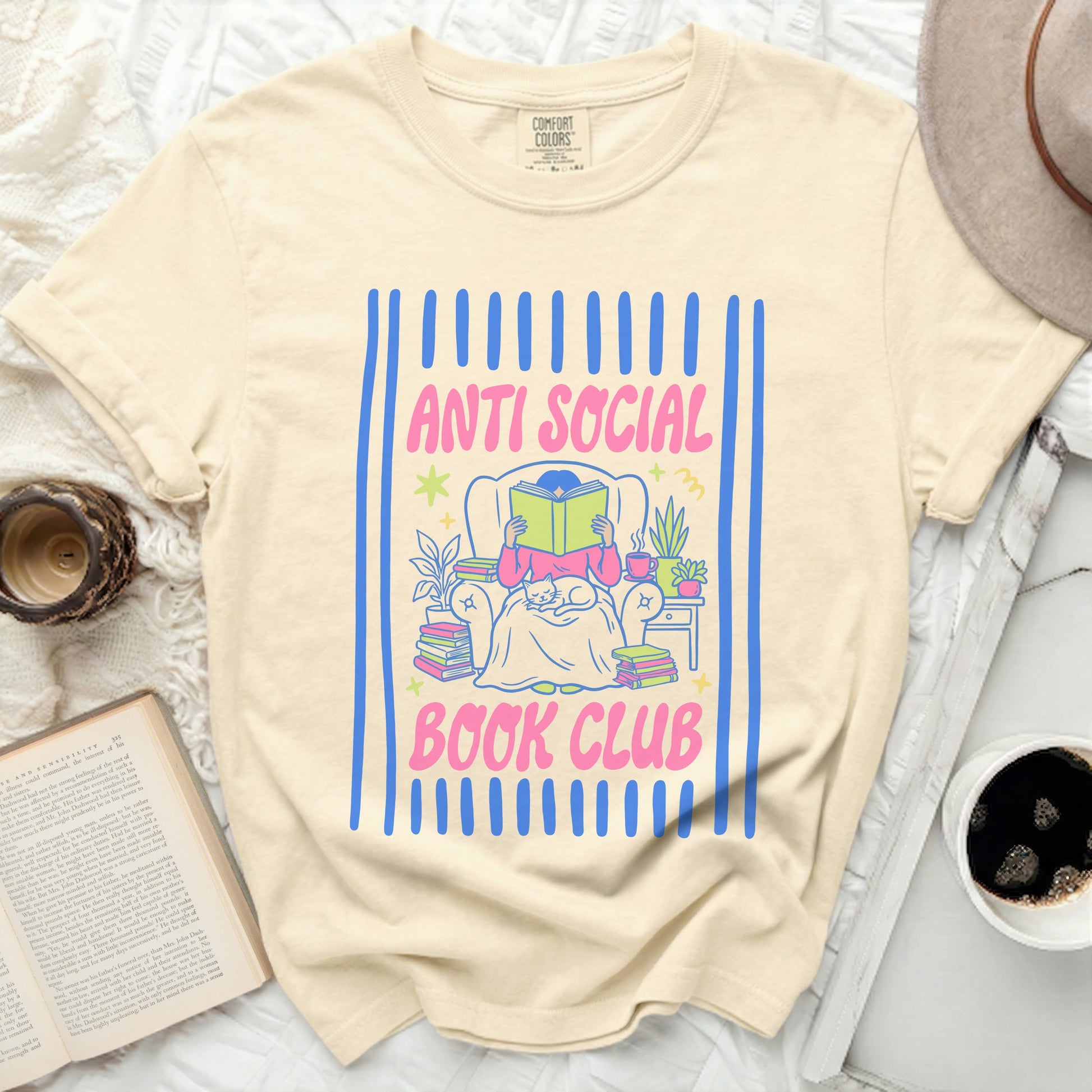 Cream t-shirt with "Anti Social Book Club" text and illustration.