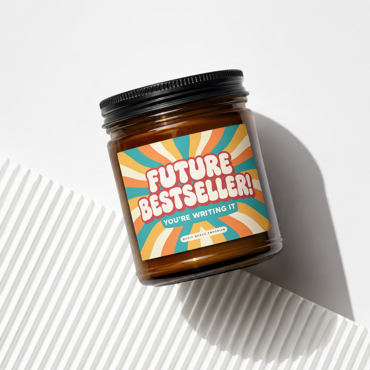Amber jar candle with "Future Bestseller! You're Writing It" label.