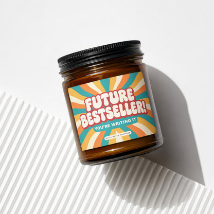 Amber jar candle with "Future Bestseller! You're Writing It" label.
