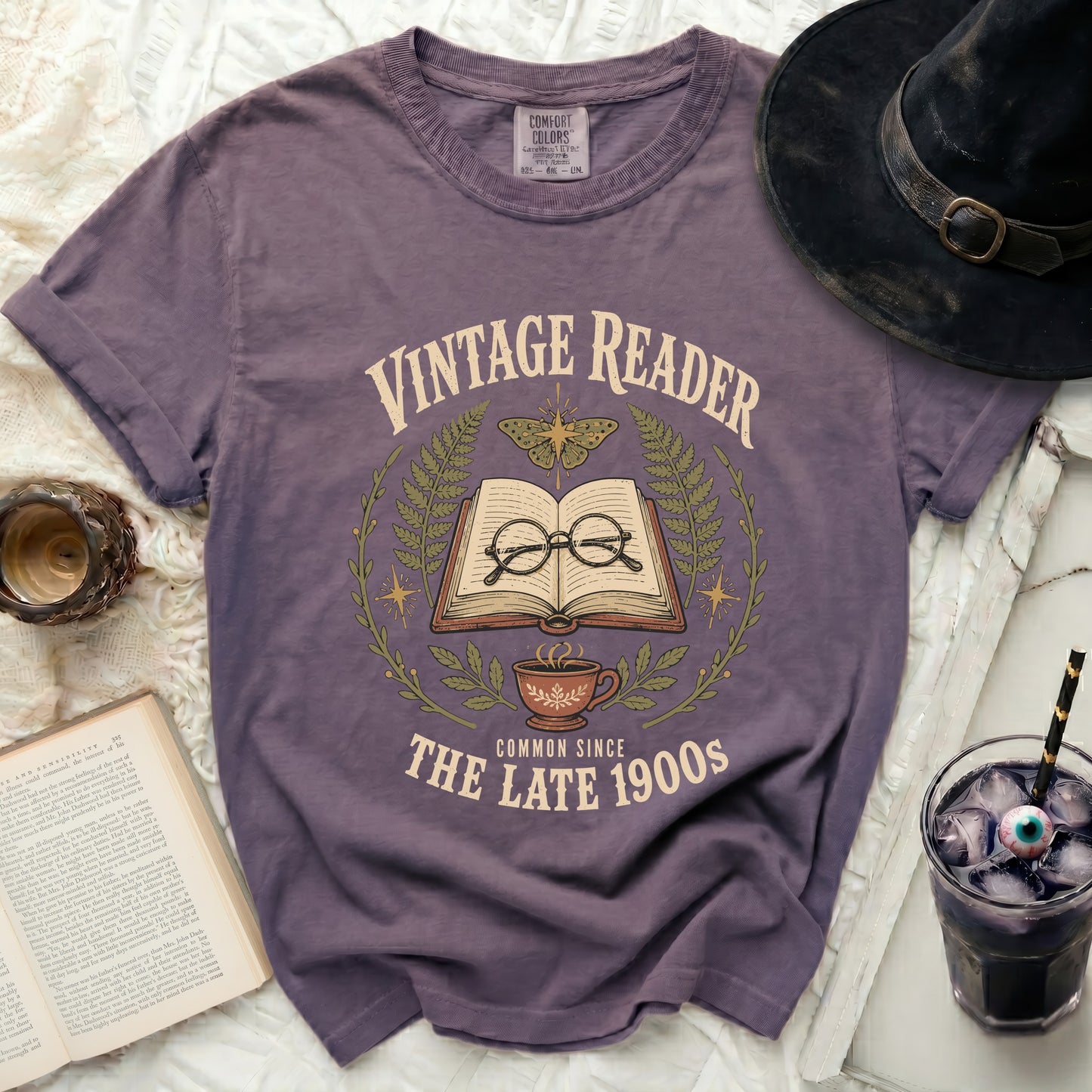 Purple t-shirt with "Vintage Reader Common Since The Late 1900s" graphic.