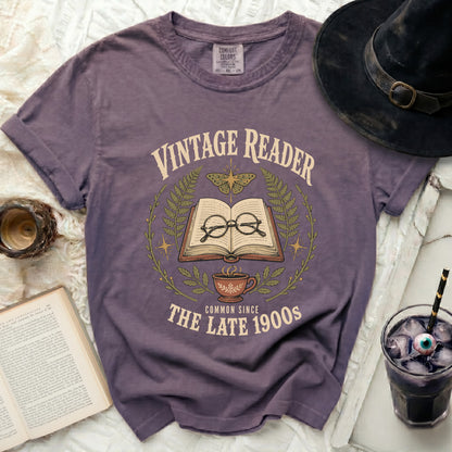Purple t-shirt with "Vintage Reader Common Since The Late 1900s" graphic.